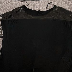 A evening top black with glitter on the top and short sleeve